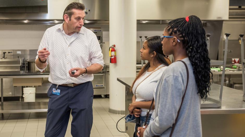 Students talk with instructor during Discover Tourism Grand Rapids' tour.