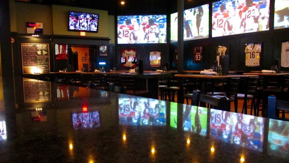In addition to tons of screens, this place boasts some serious sports paraphernalia.