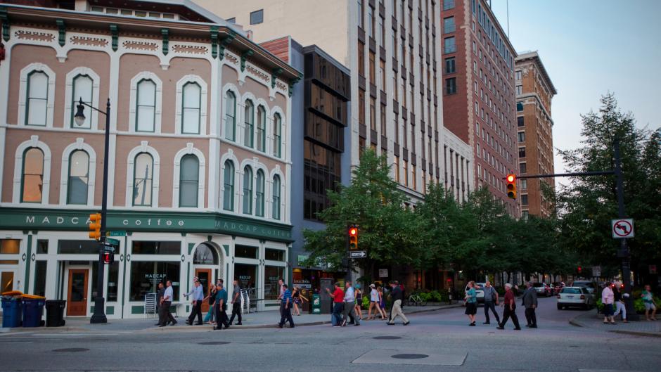 People crossing the street in front of Madcap Coffee in downtown Grand Rapids
