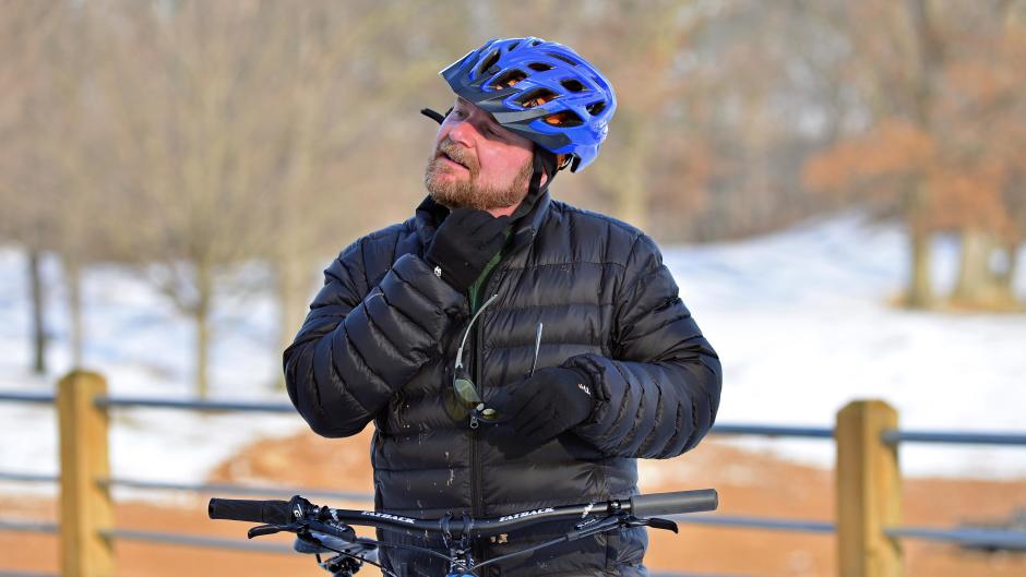 Central District Cyclery owner Nate Phelps pulls his helmet off after at ride at Indian Trails.