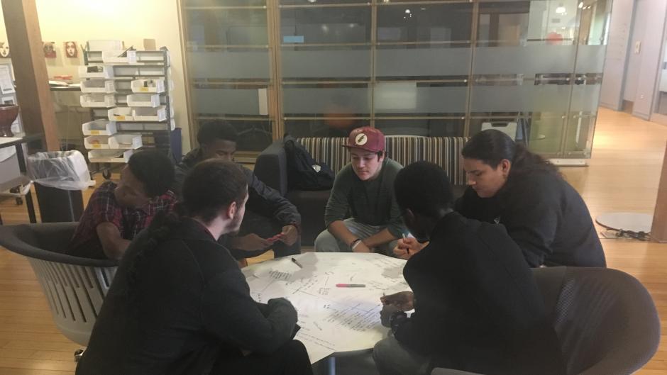 West Michigan Center for Arts and Technology teens discussing problem solving using design thinking strategy.