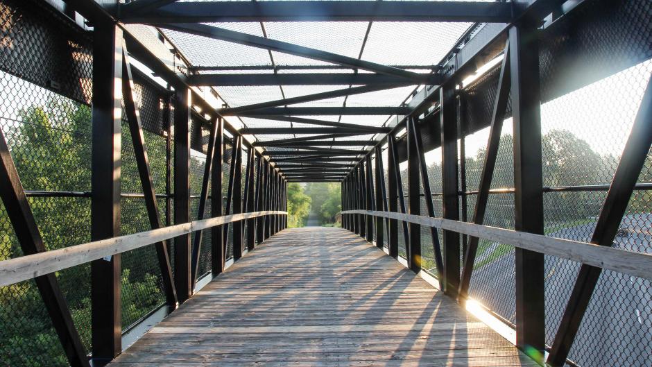 Daytime photo of White Pine Trial bridge in Rockford