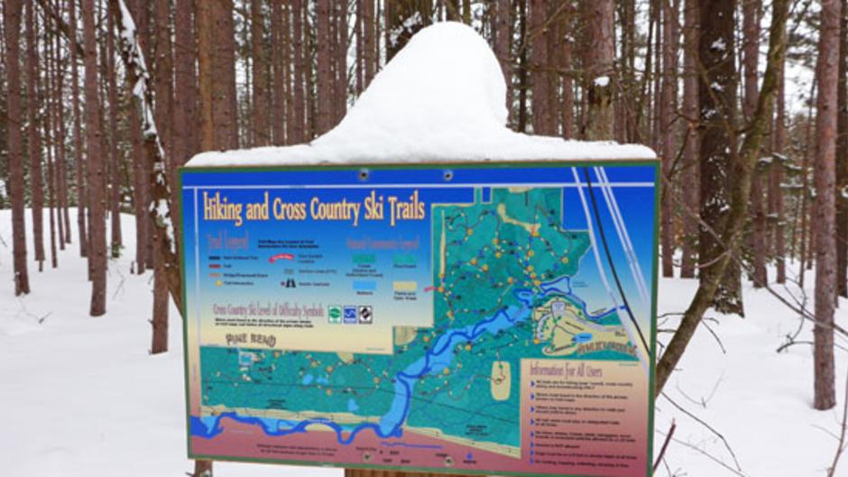 The trail system at Hemlock Crossing Park is well marked. Snowshoers and cross-country skiers share six miles of ungroomed trail, but snowshoers can readily go off-trail and explore.