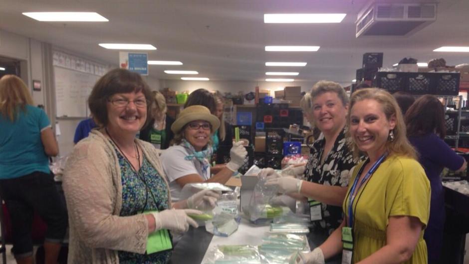 OrgPro 2014 attendees volunteering at Kids' Food Basket