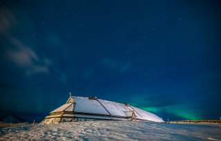 The longhouse at Lofotr Viking Museum under the midnight sun, Lofoten