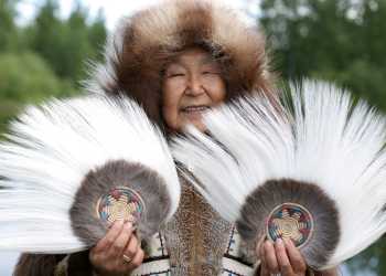 Alaska Native people; woman with fans