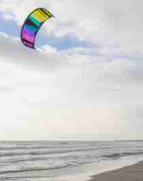 A woman kiting at orre beach outside Stavanger, Fjord Norway.
