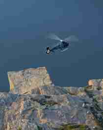 Helicopter flying over Preikestolen (The Pulpit Rock) in Fjord Norway