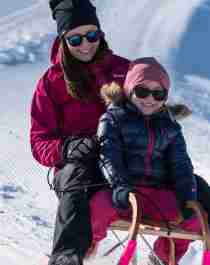 Mother and daughter tobogganing at Mount Hoven by the Loen Skylift in Loen, Fjord Norway