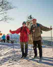 An elderly couple cross-country skiing at Mount Fløyen in Bergen, Fjord Norway