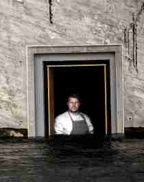 Chef Nicolai Ellitsgaard is looking out of the window at the partially submerged restaurant Under in Lindesnes, Southern Norway