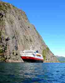 A Hurtigruten ship on the narrow Trollfjord in Northern Norway