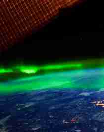 The northern lights hovering above the earth
