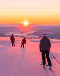 Four people skiing downhill in sunrise at Norefjell ski resort, Eastern Norway