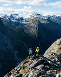 Two people hiking Mount Kattanakken in Jostedalsbreen national park, Fjord Norway
