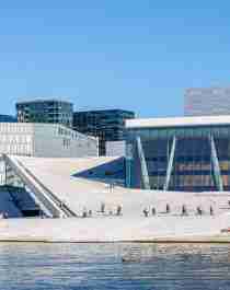 People walking across the roof of The Oslo Opera House