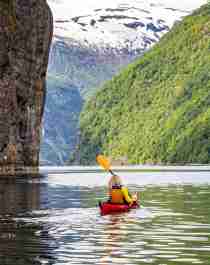 Couple kayaking on the Geiranger fjord
