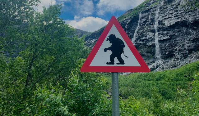 A warning sign showing a troll in Romsdalen