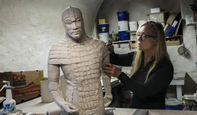 A sculptor in a workshop in Bryggen in Bergen, Fjord Norway
