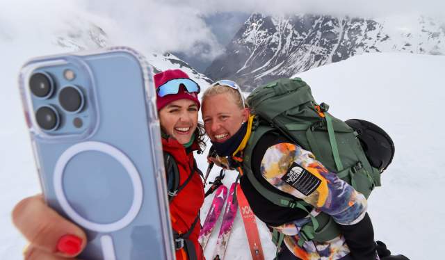 Two people taking a selfie on a ski tour at Sunnmøre, Fjord Norway.