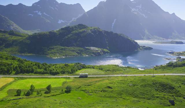 A bus in the summer landscape in Lofoten, Northern Norway.