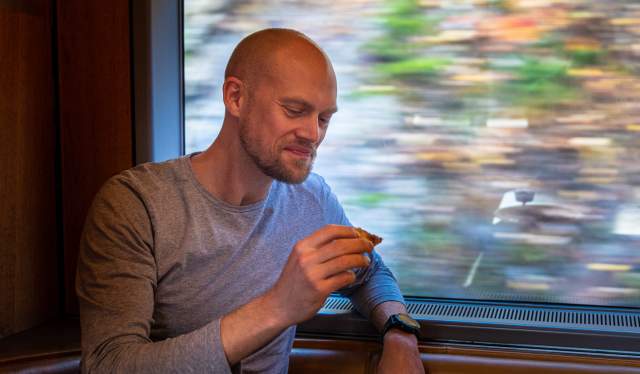 A man sitting in the cafe at the Dovre Railway