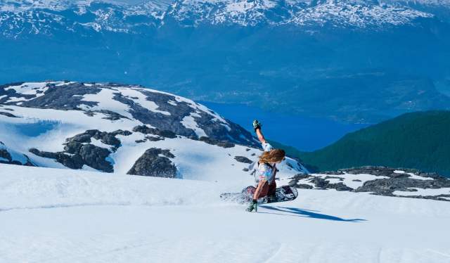 A guy snowboarding at Fonna Glacier Resort in Fjord Norway