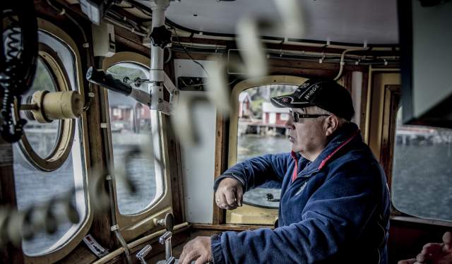 Jan Martin Johansen driving his fishing boat «Elltor» in Nusfjord in Lofoten, Northern Norway