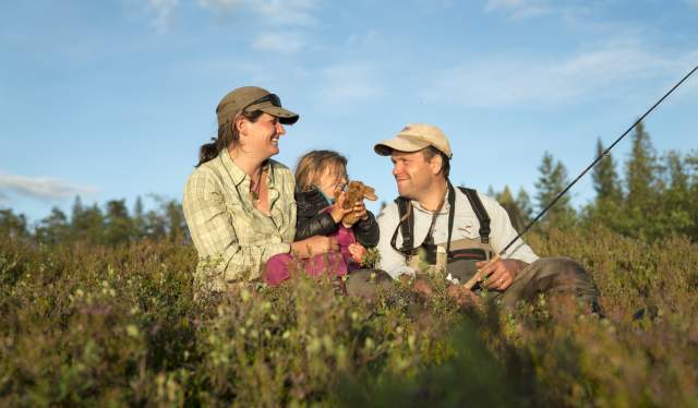 A family of three is fishing in the Blefjell mountain area in Eastern Norway