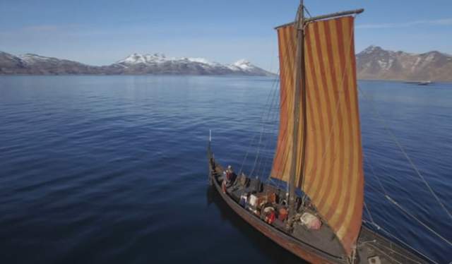 A Viking ship is sailing outside Lofotr Viking Museum