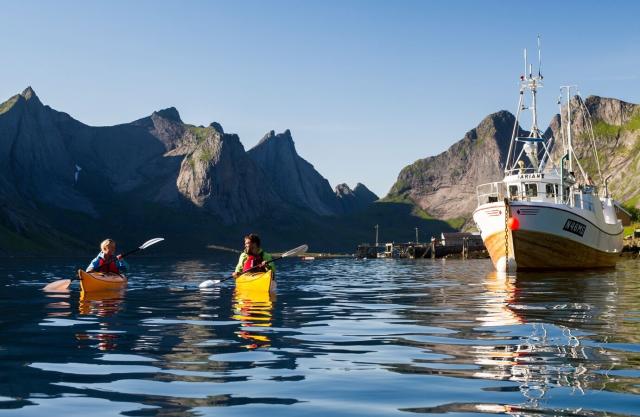 Two people kayaking in Reinefjorden