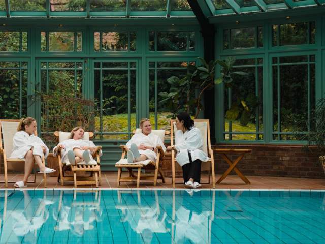 Four women relaxing by the indoor pool at Engø gård at Tjøme, Eastern Norway