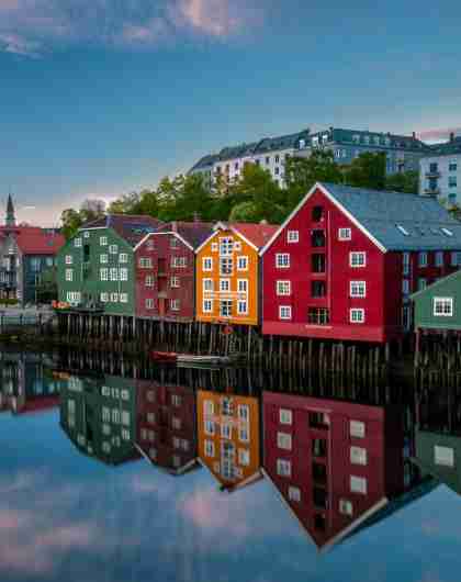 Old historic buildings along the river Nidelva in Trondheim, one of Norway’s top places to go