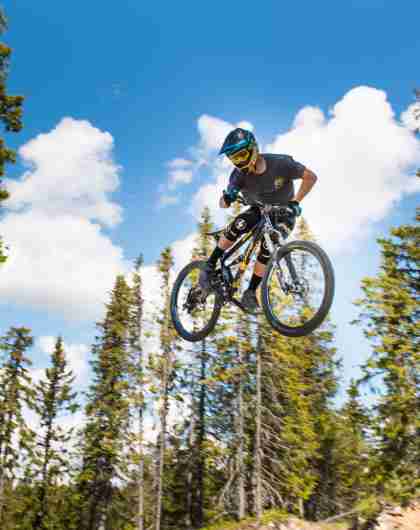 A person jumping with his mountain bike in Hafjell bike park, Eastern Norway