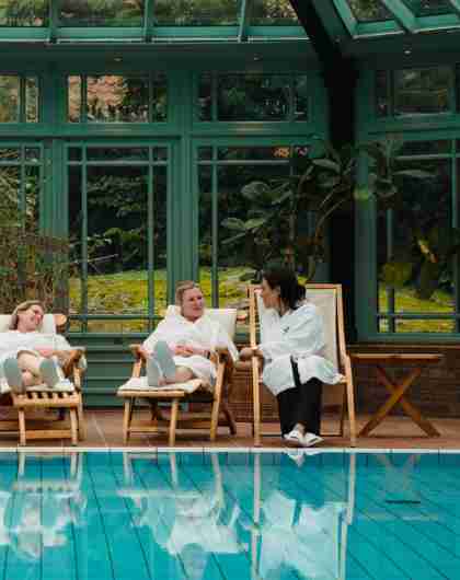 Four women relaxing by the indoor pool at Engø gård at Tjøme, Eastern Norway