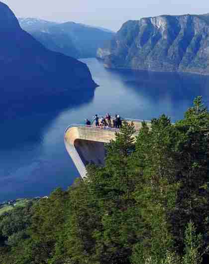 People standing at the Stegastein viewpoint along the Norwegian Scenic Route Aurlandsfjellet