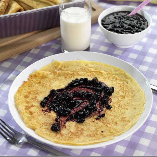 A Norwegian pancake with blueberry jam