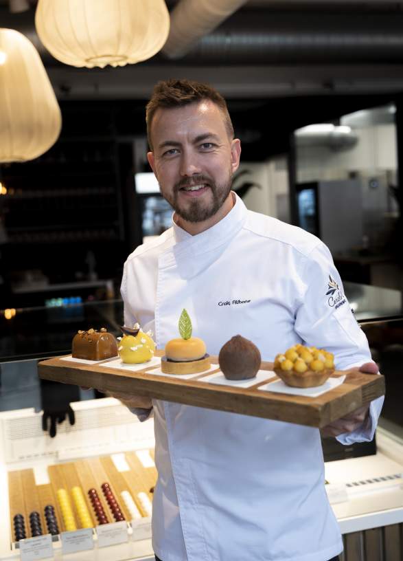 Craig Alibone holding some of his pastries in the patisserie Craig Alibone in Bodø, Northern Norway.