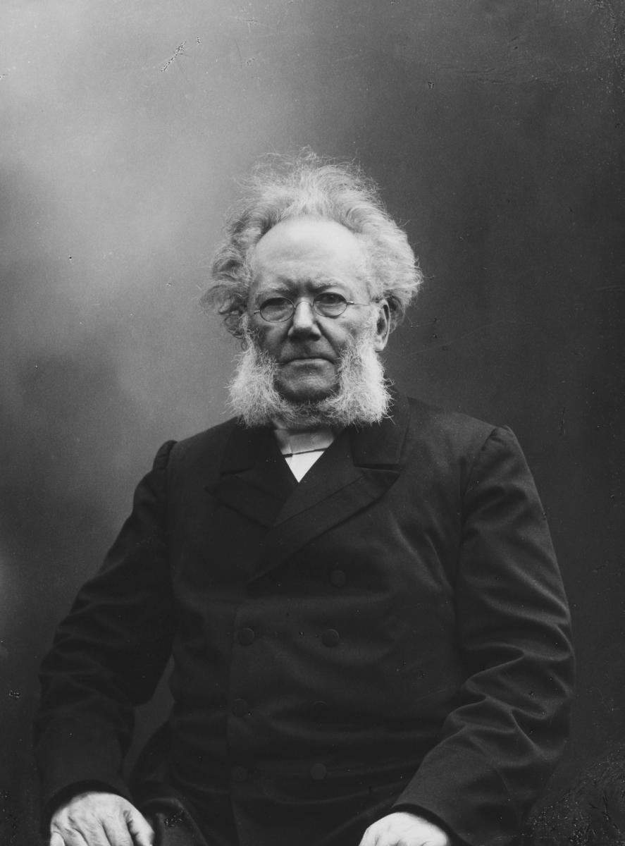 The Norwegian playwright and poet Henrik Ibsen sitting down. Black and white photo.