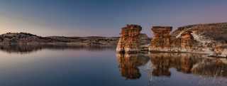 Calm waters of Wilson Lake and rock formations in Kansas