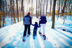 Family snowshoeing at Blandford Nature Center.