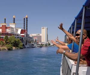 Men waving on a boat in Laughlin