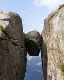 The Kjeragbolten boulder wedged in a mountain crevasse above the Lysefjord in Norway