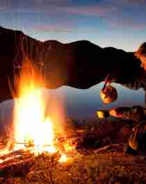 A man making coffee on a campfire in Kautokeino, Norway