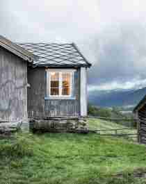 The grey houses of the farm Budsjord in the Gudbrandsdalen valley, Norway