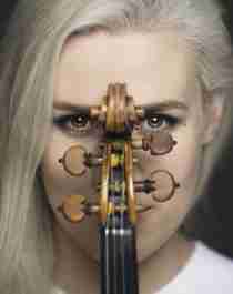 Portrait of the Norwegian violinist Eldbjørg Hemsing with her violin