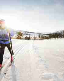 A man cross-country skiing in sunny weather in Oppdal