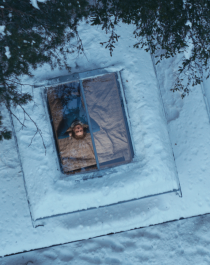Looking out of the skylight from bed in the winter