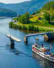 M/S Victoria passing Sundkil Bridge in Telemark, Norway