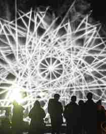 People watching light art at Fjord Oslo light art festival